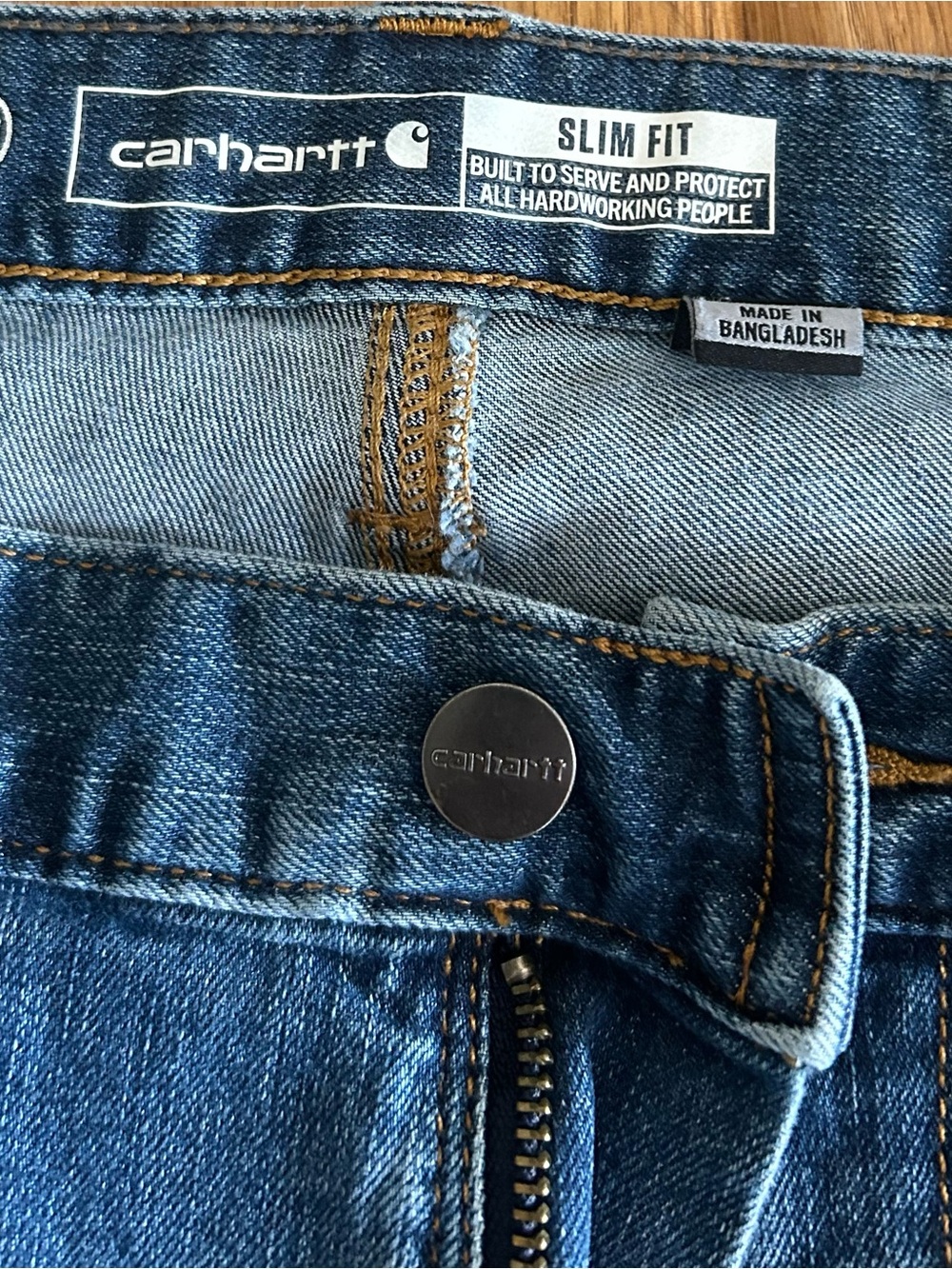 Carhartt Slim Fit Men's Denim Jeans in Blue with Brown Stitching